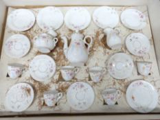 Miniature tea set in original case, comprising cups and saucers, milk jug, sugar bowl etc