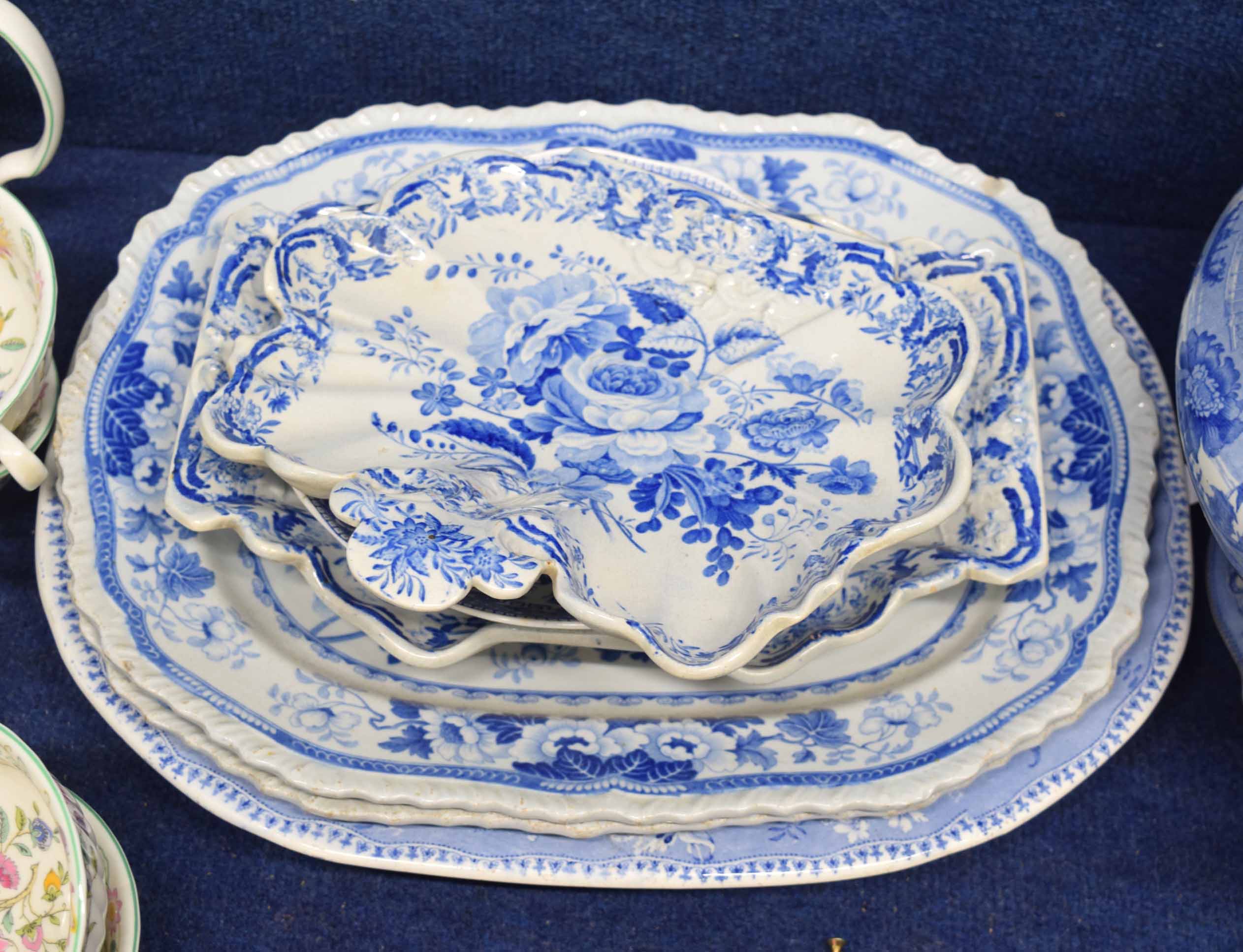 Collection of blue and white wares including a Miles Mason dish, two larger dishes with a floral