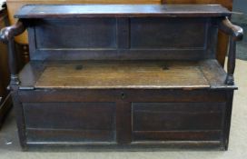 17th/18th century oak box seated settle with unusual folding section to back forming a shelf in