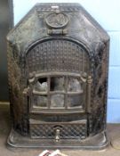 Ornate early 20th century cast iron enclosed stove of shaped rectangular design, pierced and