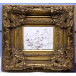 Large Parian ware plaque of classical figures in heavy gilt frame, 24cm diam