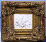 Large Parian ware plaque of classical figures in heavy gilt frame, 24cm diam