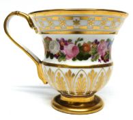 Continental porcelain cup with a gilt and floral design in Regency style, 9cm high