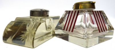 Two 1930s glass inkwells, one with brass mount, the other with silver metal mount, one with an Art