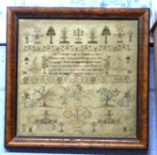 Sampler in wooden frame, worked by Sarah Morris May, 10, 1797, with typical verse and floral and