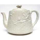 Mid-19th century pottery tea pot modelled in relief in aesthetic style, with a butterfly and flowers