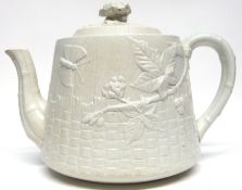 Mid-19th century pottery tea pot modelled in relief in aesthetic style, with a butterfly and flowers