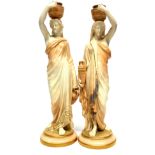 Pair of Royal Worcester water carrier figures after James Hadley, modelled as classical ladies on