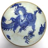 Chinese porcelain dish decorated in underglaze blue with a sinuous dragon within brown line rim,