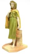 Royal Worcester model of a young girl carrying a basket, by a plinth, after Hadley, on shaped