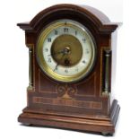 Edwardian mantel clock, the wooden case with inlay decoration, the dial flanked by two small metal