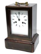 Late Victorian mantel clock in mahogany case with Roman numeral dial, 22cm high