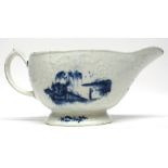 Early Lowestoft porcelain sauce boat, the body with impressed design of flowers bordering two panels