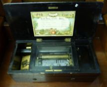 Late 19th century rosewood and ebonised cased music box with cylinder movement (7 teeth missing),