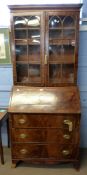 Late Georgian mahogany bureau bookcase, the top section with concave sided cornice above two glass