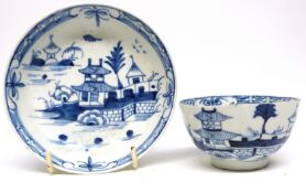 Lowestoft porcelain tea bowl and saucer, circa 1770, decorated with a pagoda type pattern within