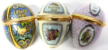 Group of three Halcyon Days enamel Easter Eggs for 1989, 1990 and 1991, all in original boxes with