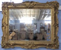 19th century gilt and gesso picture frame (now fitted as a mirror), moulded with C-scrolls and