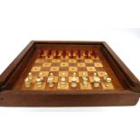 Travelling chess set with chess pieces in white and red