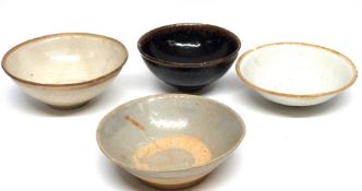 Chinese Song dynasty bowls, one with a Tenmoku type brown speckled glaze and further