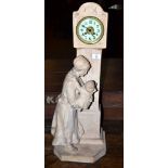 Large Dutch model of a lady and child against a model of a clock, modelled in plaster, with clock