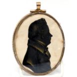 Silhouette of a gent, with lady verso, in gilt metal frame, 8cm long