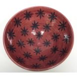Safi Middle Eastern bowl, the interior with a red glazed star design, 26cm diam