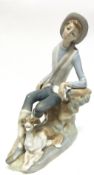 Lladro figure of a young boy with hound by his feet