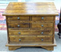 20th century hardwood chest of two, two and two drawers, with metal knob handles, 62cm wide x 50cm