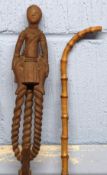 Unusual wooden walking stick, possibly African, modelled with a lady as the handle, together with