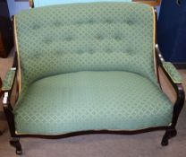 Late 19th century dark stained three piece cottage suite comprising a two-seater sofa and two