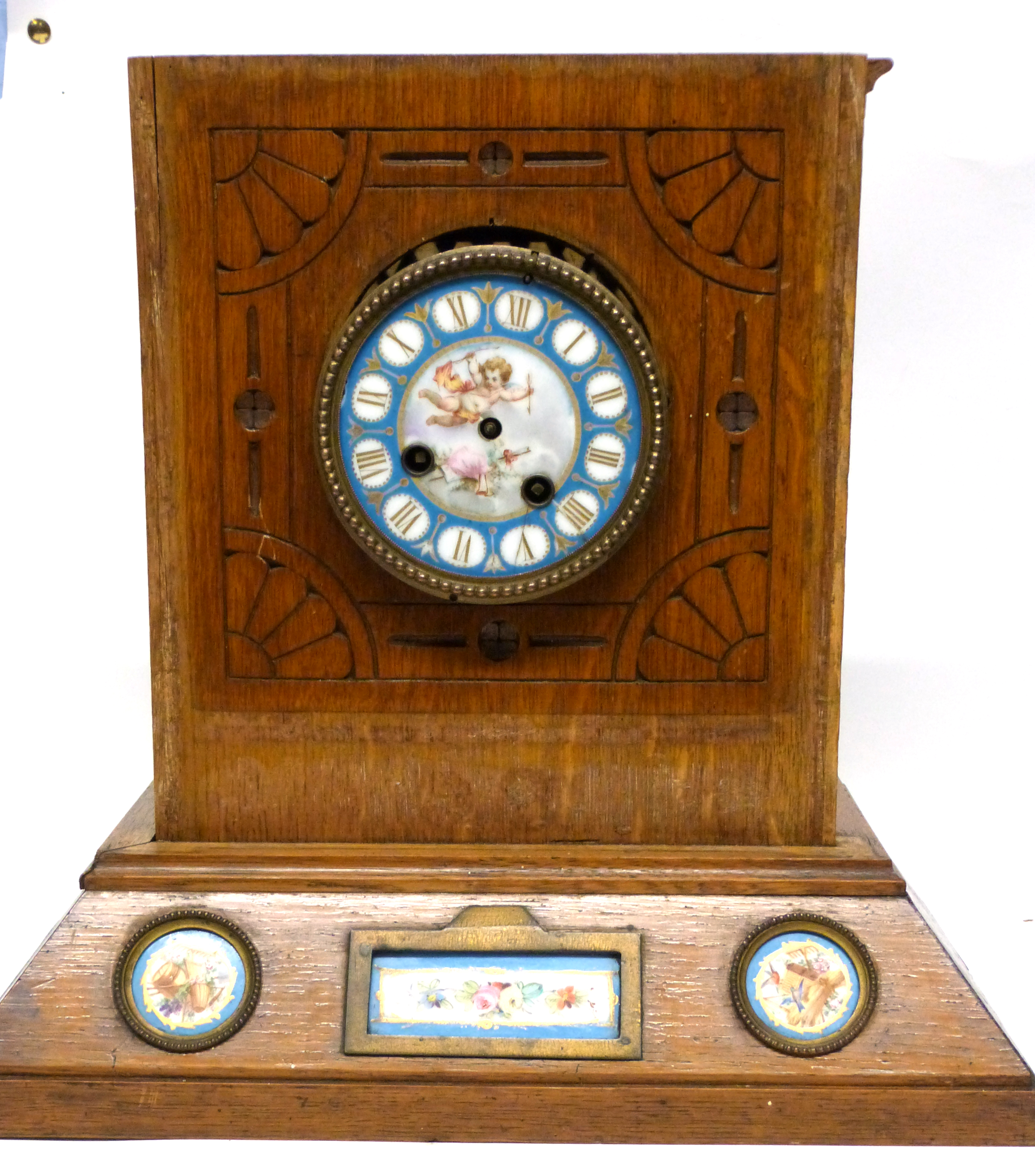 Sevres style clock with dial and inset into a light oak wooden frame, etched with an Art Nouveau