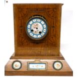 Sevres style clock with dial and inset into a light oak wooden frame, etched with an Art Nouveau
