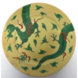 Chinese porcelain 19th century yellow ground plate decorated in famille vert with a sinuous