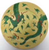 Chinese porcelain 19th century yellow ground plate decorated in famille vert with a sinuous