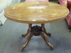 Victorian small walnut oval loo table, the top quartered veneered and with marquetry inlay, tip-