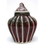 Chinese pottery gourd shaped vase and cover, in a flambe type glaze, 12cm high