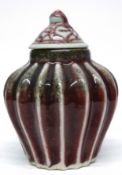 Chinese pottery gourd shaped vase and cover, in a flambe type glaze, 12cm high