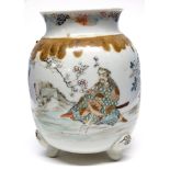 Japanese porcelain vase on three stud feet decorated with Samurai in a landscape setting with