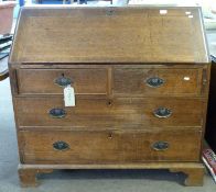 Georgian oak bureau of plain design, having fall flap over two short and two long drawers with