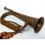 Copper military bugle with brass inlay and sash, 30cm long