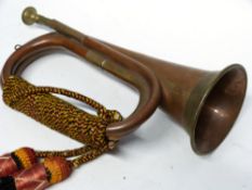 Copper military bugle with brass inlay and sash, 30cm long