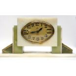 Art Deco mantel clock in stepped onyx base, the clock with gilt oval case, made by DEP, French made,