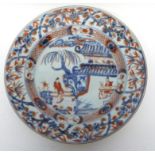 18th century Chinese porcelain blue and white plate decorated in overglaze red enamel with flowers