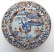18th century Chinese porcelain blue and white plate decorated in overglaze red enamel with flowers
