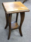 Small 20th century oak stool/stand with plain top, four curved legs joining a small base shelf,