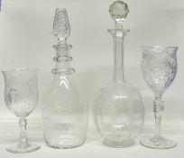 Two decanters, one with an air twist knop, the other with an engraved floral design, together with