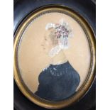 Victorian silhouette of a lady set into a black wooden frame, 17cm long