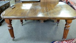 Victorian mahogany small extending dining table of wind-out type, having a rectangular top with