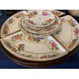 Pottery lazy susan on wooden tray with a floral design, the base marked "T Goode & Co, South